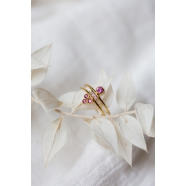 gold ring with diamonds and pink sapphires